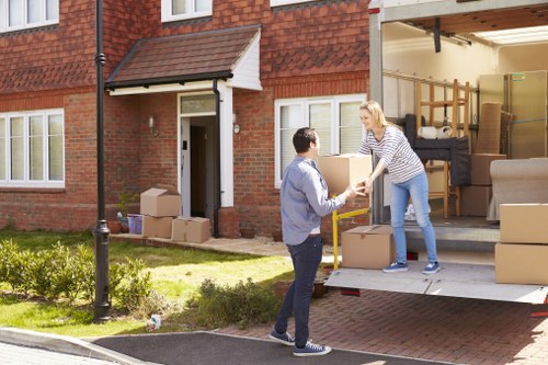 Man and van moving boxes in Sidcup residential street