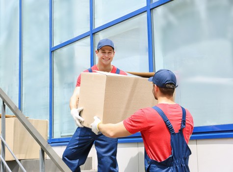 Sidcup furniture movers handling bulky items with protective wrapping