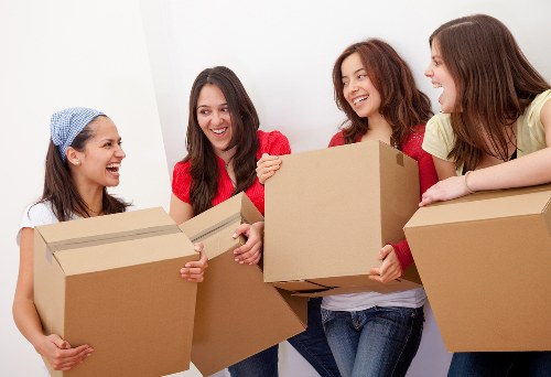 Professional flat removals planning in Sidcup with packed boxes and moving van