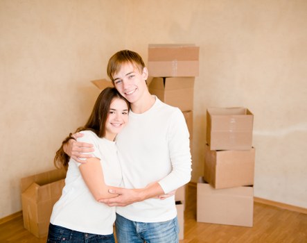 Mover protecting a doorway while transporting furniture