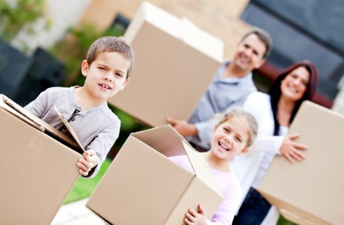 Professional movers carrying furniture during a same day move in Sidcup