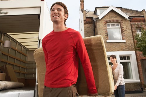 Professional team handling piano removals in Sidcup inside a home