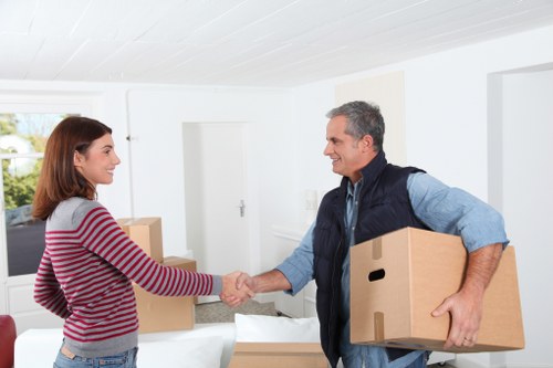 Movers handling apartment stairs during flat removals in Sidcup