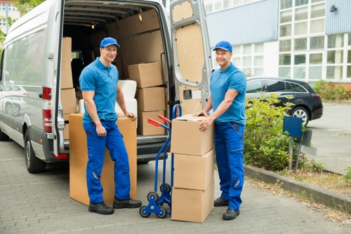 Removal team carrying furniture during a Sidcup home move