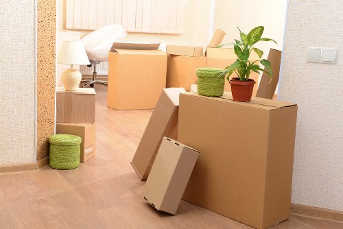 Team communicating during a careful moving operation with secured items